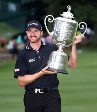 Jul 31, 2016; Springfield, NJ, USA; PGA golfer Jimmy Walker holds up the Wanamaker Trophy after winning the 2016 PGA Championship golf tournament at Baltusrol GC - Lower Course. Mandatory Credit: Brian Spurlock-USA TODAY Sports