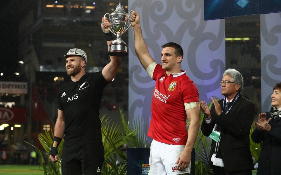 Captains Kieran Reed and Sam Warburton lift the trophy after the drawn series of 2017 - Getty Images