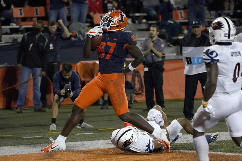 Illinois tight end Daniel Barker celebrates his touchdown reception during the second half of an NCAA college football game against UTSA, Saturday, Sept. 4, 2021, in Champaign, Ill. (AP Photo/Charles Rex Arbogast)