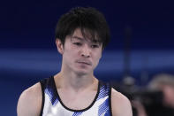 FILE - In this July 24, 2021, file photo, Kohei Uchimura, of Japan, reacts after falling from the horizontal bar during the men's artistic gymnastic qualifications at the 2020 Summer Olympics in Tokyo. The 50th artistic gymnastics world championships started Monday, Oct. 18, 2021 and will continue through Sunday in Kitakyushu, featuring more than 300 gymnasts representing 59 countries. (AP Photo/Ashley Landis, File)