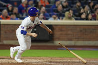 New York Mets' Joey Wendle watches his RBI double during the seventh inning of the team's baseball game against the Pittsburgh Pirates on Tuesday, April 16, 2024, in New York. (AP Photo/Seth Wenig)