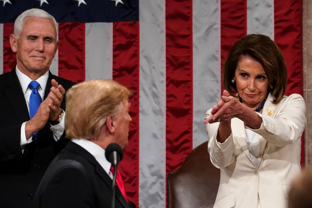 US President Donald Trump arrives to deliver the State of the Union address, alongside Speaker of the House Nancy Pelosi and Vice President Mike Pence ,at the US Capitol in Washington, DC, on February 5, 2019.