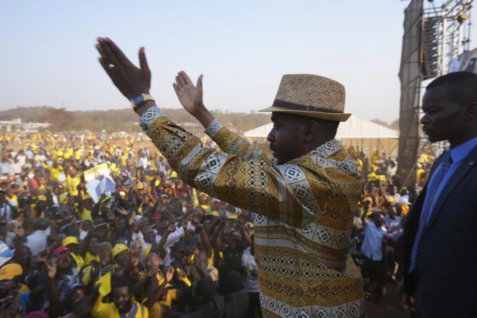 Zimbabwe's main opposition leader Nelson Chamisa is surrounded by security as he leaves his last campaign rally in Harare, Monday, Aug 21, 2023. The upcoming general election in Zimbabwe is crucial to determining the future of a southern African nation endowed with vast mineral resources and rich agricultural land. But for many in the educated but underemployed population, the daily grind to put food on the table inhibits interest in politics. (AP Photo/Tsvangirayi Mukwazhi)