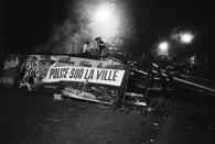 <p>Demonstrating students found a ready-made propaganda banner when they tore down a movie marquee advertising a police film, “Police sur la Ville,” (“Madigan”) co-starring Richard Widmark and Henry Fonda, on the Boulevard Saint-Michel in Paris, May 10-11, 1968. (Photo: Gökşin Sipahioğlu/SIPA) </p>