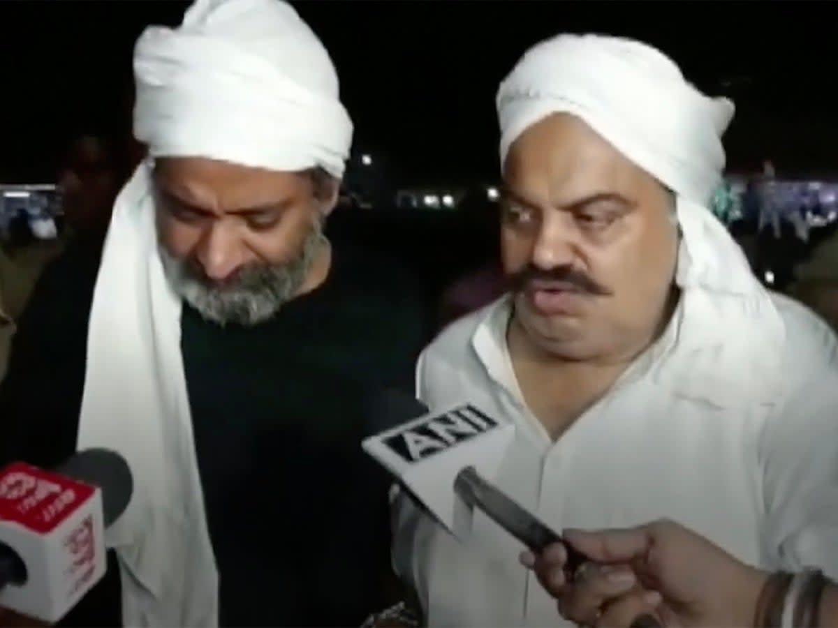 Ashraf Ahmed (left) and Atiq Ahmed moments before being murdered on live TV (ANI)