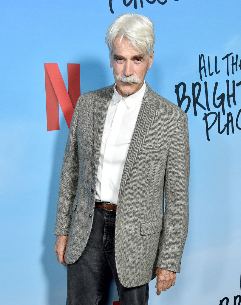 With white hair and mustache at a Netflix premiere