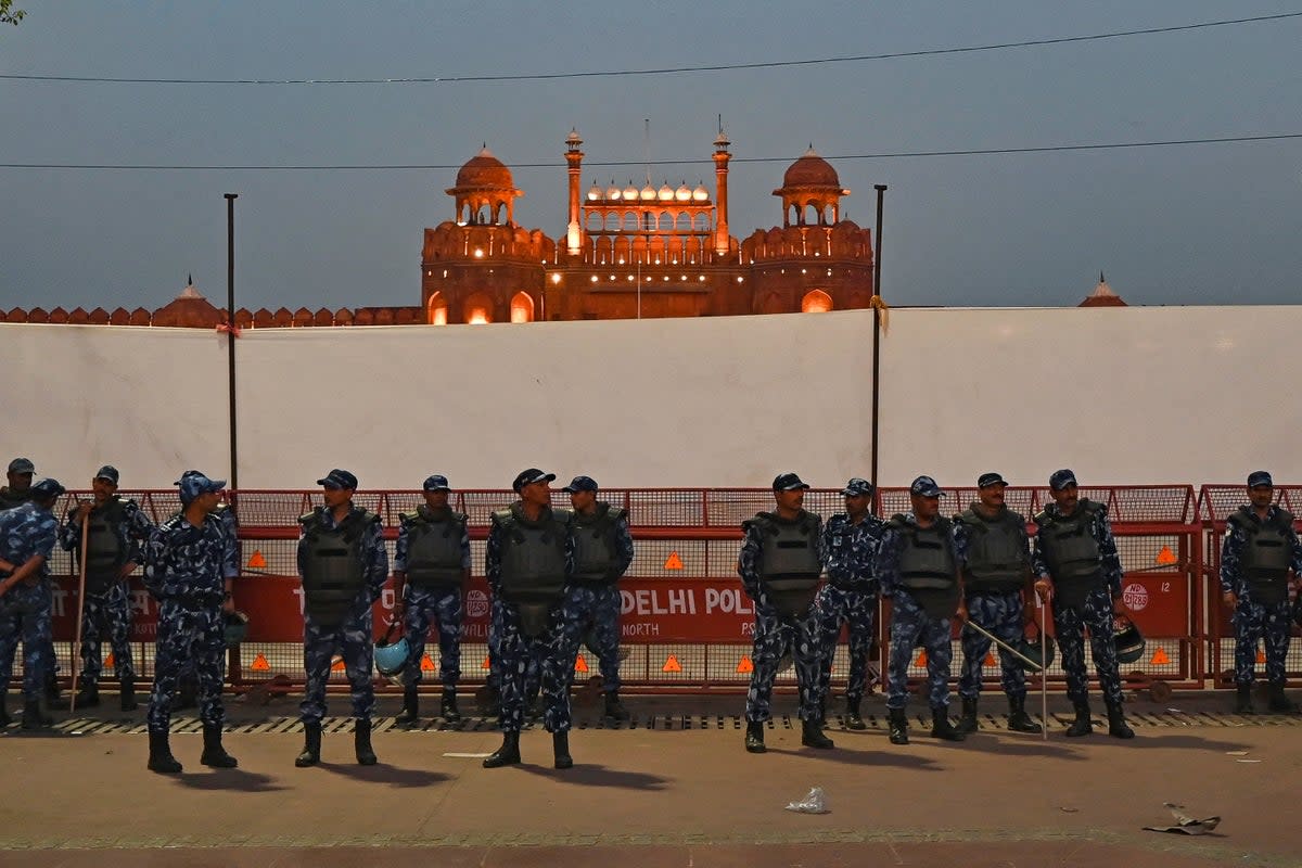 Rapid Action Force (RAF) personnel stand guard infront of the Red Fort during a protest march by India’s Congress party against conviction of Congress party leader Rahul Gandhi in a criminal defamation case, in New Delhi on 28 March 2023 (AFP/Getty)