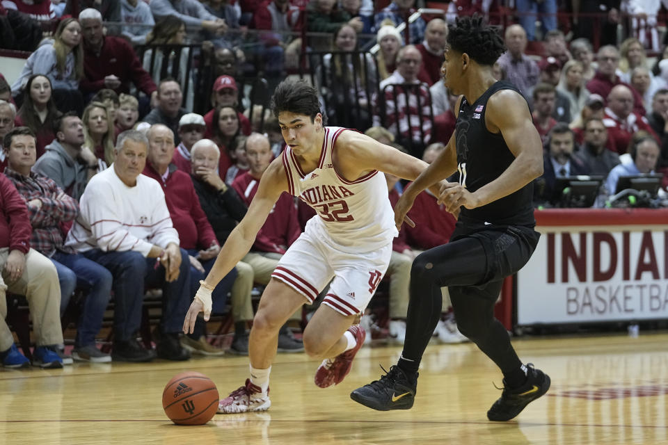 Indiana's Trey Galloway (32) goes to the basket against Michigan State's A.J. Hoggard during the second half of an NCAA college basketball game, Sunday, Jan. 22, 2023, in Bloomington, Ind. (AP Photo/Darron Cummings)