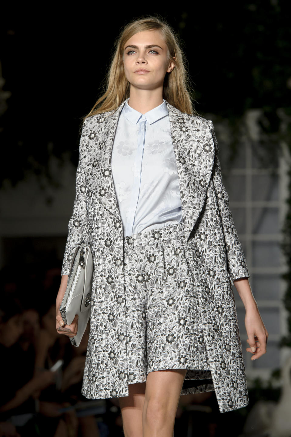 British model Cara Delevingne wears a design created by Mulberry during London Fashion Week Spring/Summer 2014, at Claridges Hotel in central London, Sunday, Sept. 15, 2013. (Photo by Jonathan Short/Invision/AP)