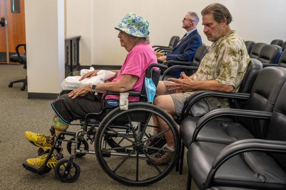 Linda Siegrist, 69, a double amputee, and her husband Bruce, 67, anxiously wait for a hearing at Sacramento Superior Court on May 18 to see if they can keep Linda’s childhood home. Dan Collins of the Bay Area Receivership Group – the company forcing the sale – waits in the background.