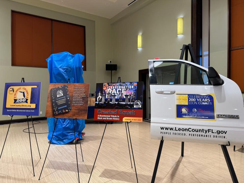 The bicentennial steering committee shared with the Leon County commission upcoming events and initiatives such as a branded library card (left) and decorations to be added to county vehicles (right).