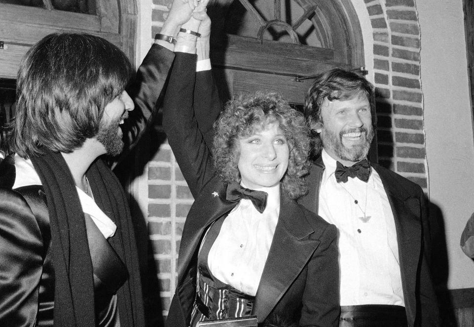 FILE - In this Dec. 23, 1976 file photo, producer Jon Peters, from left, Barbra Streisand and Kris Kristofferson appear at a preview of the film, 