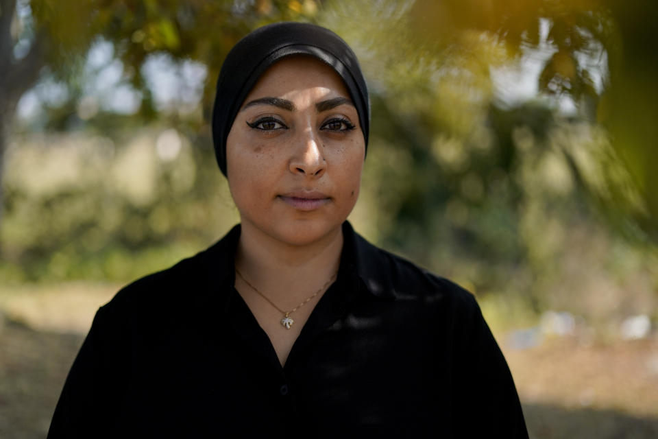 Maryam al-Khawaja poses for a photograph outside Heathrow airport, in London, Friday, Sept. 15, 2023, as the daughter of the long-detained human rights activist in Bahrain, 62-year-old Abdulhadi al-Khawaja, plans to return to the island kingdom Friday to press for the release of her father, even as she faces imprisonment herself. (AP Photo/Alberto Pezzali)