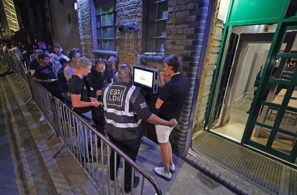 People have their ID checked as they queue up for the Egg nightclub in London (PA Wire)