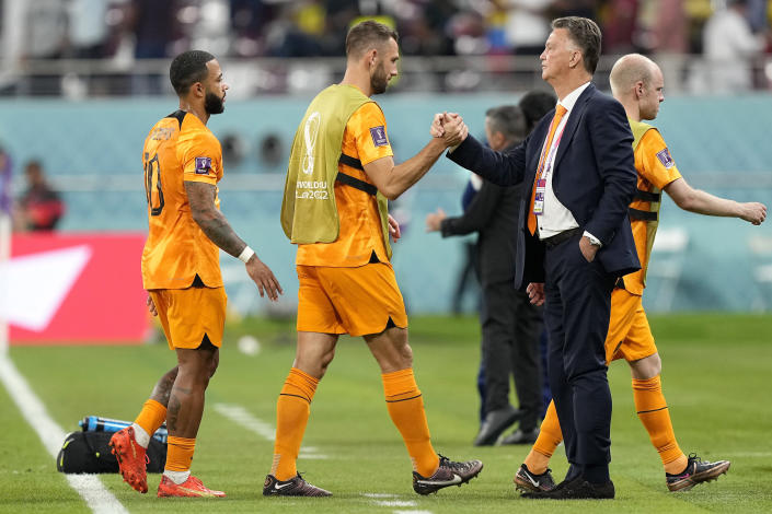 head coach Louis van Gaal of the Netherlands, right, waits for the players after the World Cup group A soccer match between the Netherlands and Ecuador, at the Khalifa International Stadium in Doha, Qatar, Friday, Nov. 25, 2022. (AP Photo/Martin Meissner)