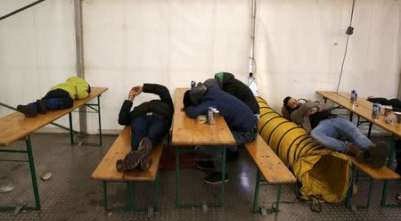 Migrants sleep on the compound of the Berlin Office of Health and Social Affairs (LAGESO) while waiting for their registration process in Berlin, Germany, January 29, 2016. REUTERS/Fabrizio Bensch