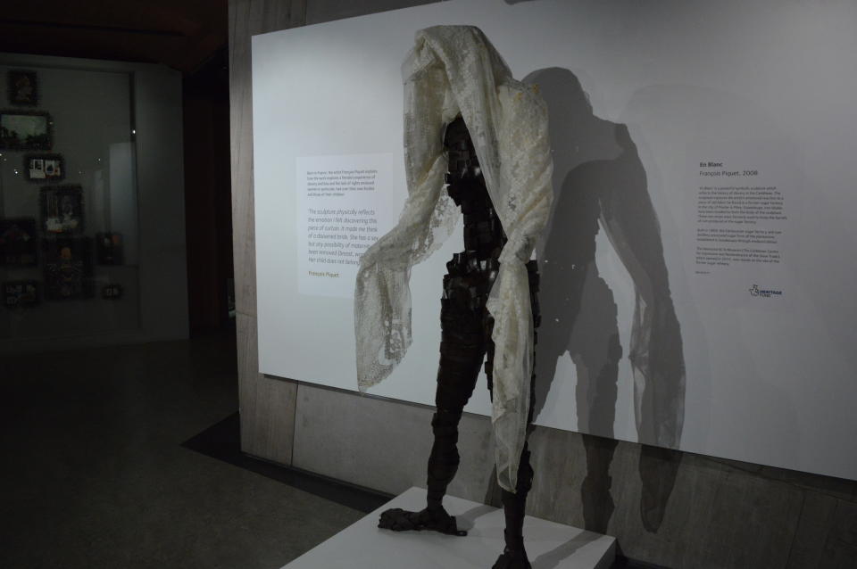 In this Nov. 24, 2019 photo, a sculpture entitled, "En Blanc," by French artist Francois Piquet, which tackles the themes of women in slavery in the Caribbean, is displayed at the International Slavery Museum in Liverpool, England. The museum seeks to tell the story of the enslavement of people from Africa and how the British city benefited from human bondage. (AP Photo/Russell Contreras)