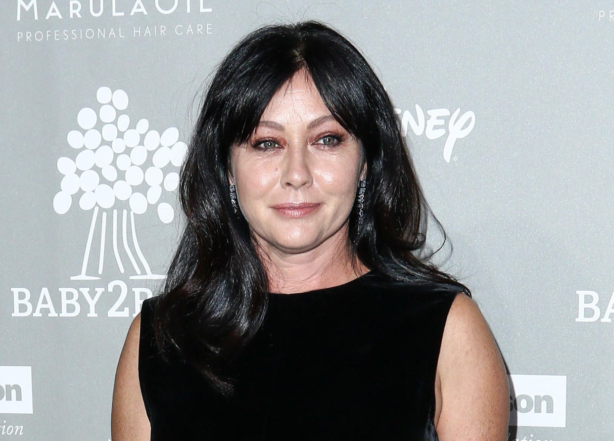 FILE - In this Nov. 14, 2015 file photo, Shannen Doherty attends the 4th Annual Baby2Baby Gala in Culver City, Calif. Court records show Doherty has reached a conditional settlement with her former business managers in a lawsuit in which she accused them of mismanaging her money and causing a lapse in her health insurance that led to a delay in her being diagnosed with breast cancer. The settlement notice filed  Friday, Aug. 19, 2016, in Los Angeles states certain undisclosed settlement  terms must happen within 45 days. (Photo by John Salangsang/Invision/AP, File)