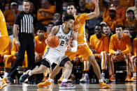 Vanderbilt guard Scotty Pippen Jr. (2) drives against Tennessee guard Santiago Vescovi (25) during an NCAA college basketball game Tuesday, Jan. 18, 2022, in Nashville, Tenn. (AP Photo/Wade Payne)