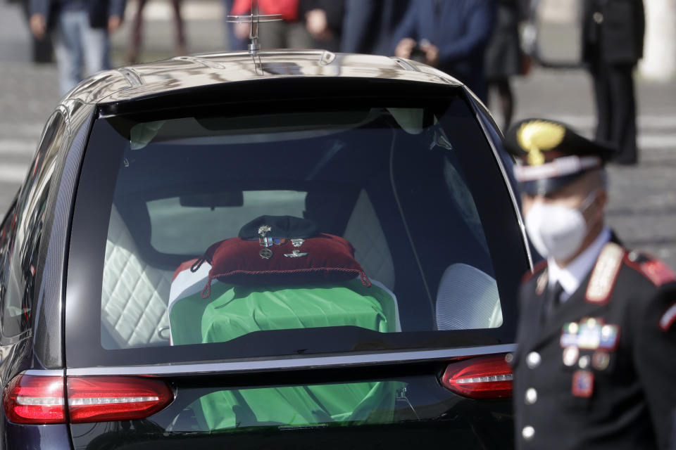 The casket of Italian Carabinieri police officer Vittorio Iacovacci, draped in the Italian flag, is driven away at the end of the state funeral for Italian ambassador to the Democratic Republic of Congo Luca Attanasio and Iacovacci, in Rome, Thursday, Feb. 25, 2021. Italy paid tribute Thursday to its ambassador to Congo and his bodyguard who were killed in an attack on a U.N. convoy, honoring them with a state funeral and prayers for peace in Congo and all nations "torn by war and violence." (AP Photo/Andrew Medichini)