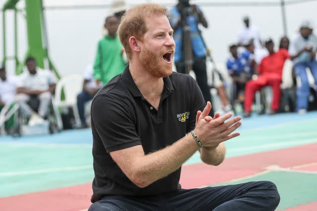 <p>KOLA SULAIMON/AFP via Getty</p> Prince Harry participates in a exhibition sitting volleyball match at Nigeria Unconquered on May 11, 2024.