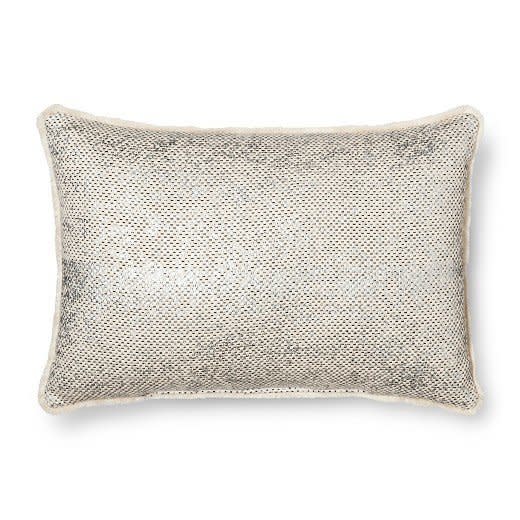 Get it <a href="https://www.target.com/p/throw-pillow-metallic-mini-fringe-oblong-threshold-153/-/A-50980084#lnk=newtab" target="_blank">here</a>.&nbsp;