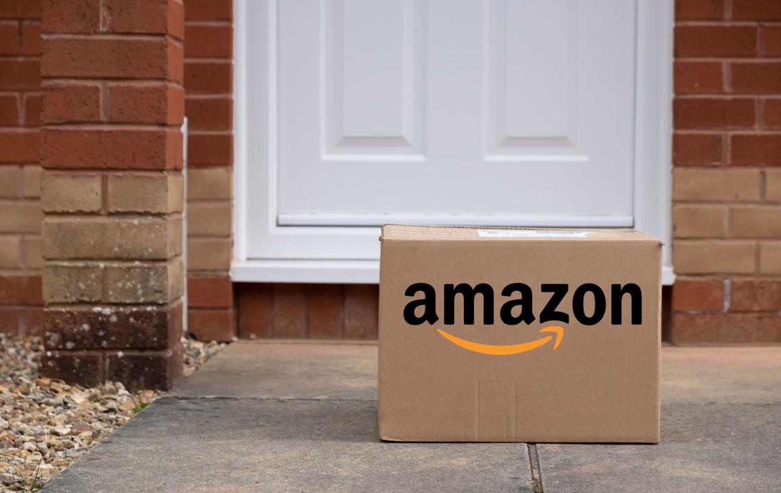 Exeter, UK-10 March 2024: An Amazon delivery box in front of a doorstep. Amazon is considered one of the Big Five American technology companies