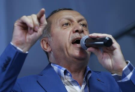 Turkish President Tayyip Erdogan delivers a speech to his supporters in Istanbul, Turkey, July 16, 2016. REUTERS/Murad Sezer