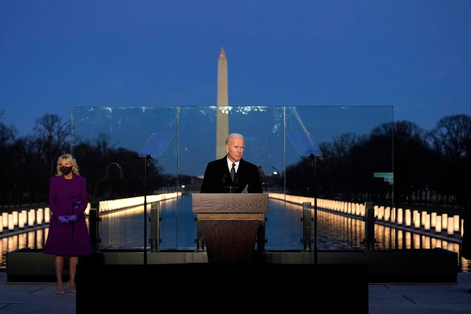 President-elect Joe Biden speaks during a COVID-19 memorial, with lights placed around the Lincoln Memorial Reflecting Pool, Tuesday, Jan. 19, 2021, in Washington (AP)