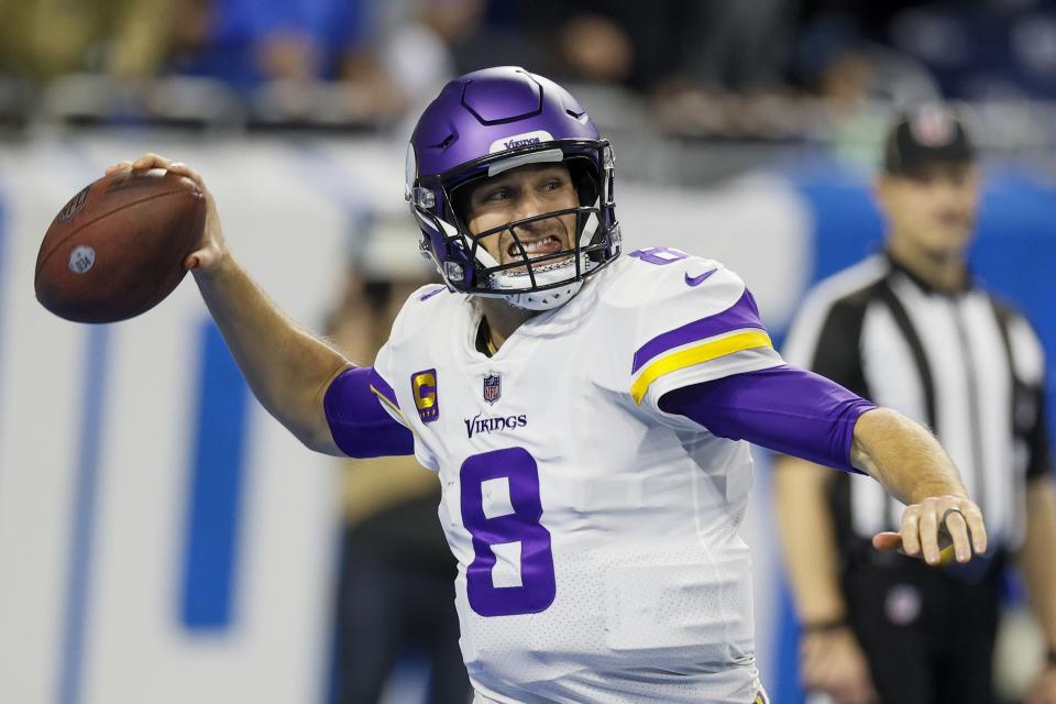 FILE - Minnesota Vikings' Kirk Cousins throws during the first half of an NFL football game against the Detroit Lions, Dec. 11, 2022, in Detroit. Cousins is leaving Minnesota for Atlanta, landing another big contract with a well-timed foray into free agency. Cousins' agent Mike McCartney announced on social media that his client has agreed to a four-year deal with the Falcons. (AP Photo/Duane Burleson, File)