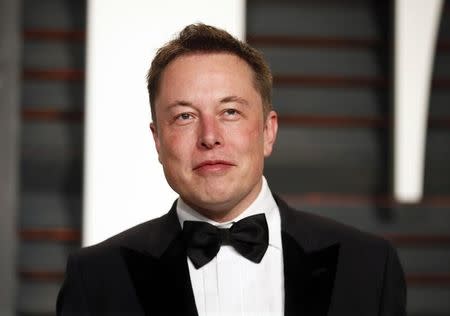 Elon Musk arrives at the 2015 Vanity Fair Oscar Party in Beverly Hills, California February 22, 2015. REUTERS/Danny Moloshok