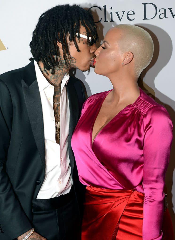 Wiz Khalifa and Amber Rose pucker up. (Photo: Scott Dudelson/Getty Images)