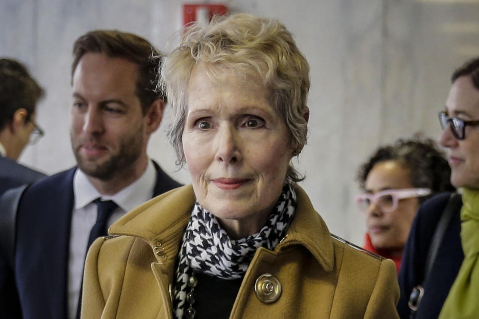 FILE - E. Jean Carroll, center, waits to enter a courtroom in New York for her defamation lawsuit against President Donald Trump, March 4, 2020. Jury selection is set to start Tuesday, April 25, 2023, in the case involving allegations by advice columnist Carroll, who says Donald Trump raped her in a luxury department store dressing room in the 1990s.(AP Photo/Seth Wenig, File)