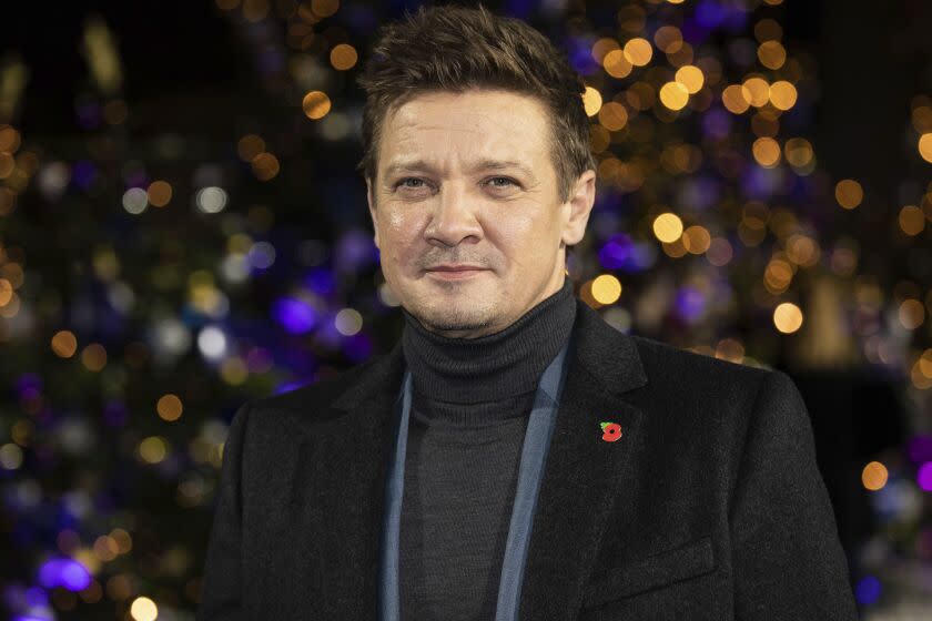 Jeremy Renner in a turtleneck and blazer