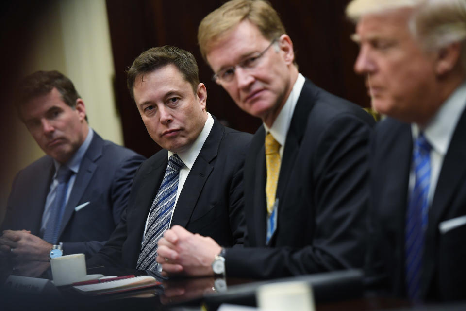 WASHINGTON, DC - JANUARY 23: Kevin Plank of Under Armour, left to center, Elon Musk of SpaceX and Wendell P. Weeks of Corning listen to President Donald Trump during a meeting with business leaders in the Roosevelt Room of the White House on Monday January 23, 2017 in Washington, DC. CEO's from a number of top U.S. companies were in attendance. The president spoke about possible cuts in regulations that can be made. (Photo by Matt McClain/The Washington Post via Getty Images)
