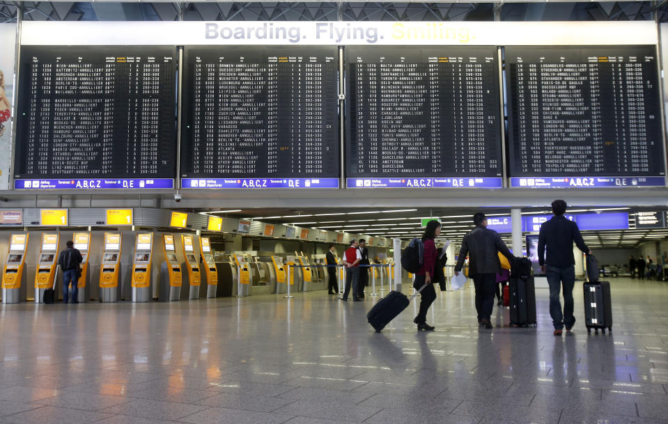 A terminal is almost empty as public-sector employees of the Frankfurt airport go on a warning strike, demanding higher wages in Frankfurt, Germany, Thursday, March 27, 2014. Germany's largest airline Lufthansa alone said it was cancelling 600 flights Thursday, from primarily within Europe, as a result of the strike. (AP Photo/Michael Probst)