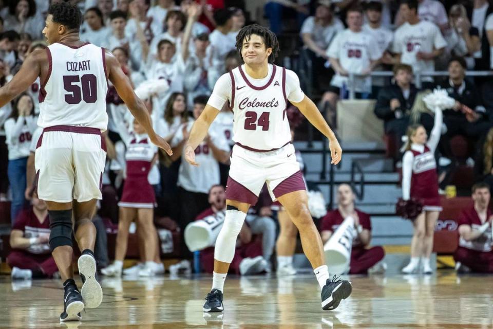 Isaiah Cozart (50) congratulates Michael Moreno (24) during a game earlier this season. Moreno will finish his career as EKU’s all-time leader in 3-pointers made. Ryan C. Hermens/rhermens@herald-leader.com