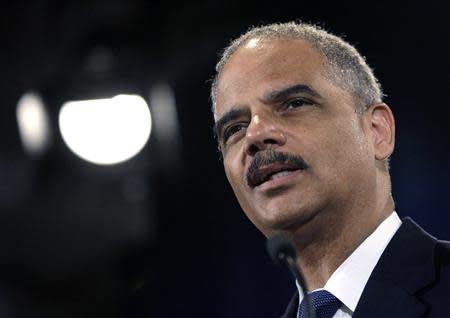 U.S. Attorney General Eric Holder speaks at the Justice Department in Washington in this file photo taken June 25, 2013. REUTERS/Jonathan Ernst/Files