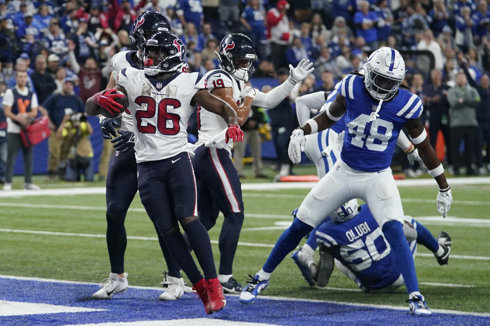 Houston Texans running back Devin Singletary (26) scores a rushing touchdown during the second half of an NFL football game against the Indianapolis Colts, Saturday, Jan. 6, 2024, in Indianapolis. (AP Photo/Darron Cummings)