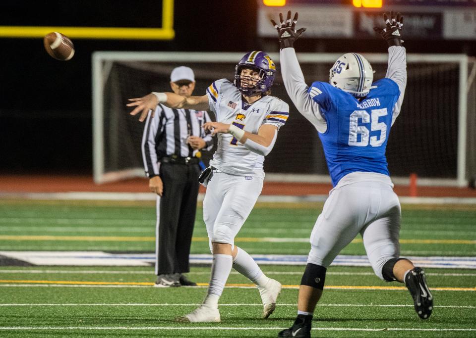 Escalon's Donovan Rozevink, left, throws a pass under pressure from Acalanes' Brady Morrow during the 2023 CIF Div. 3-AA State Football Championship semifinal game at Acalanes High School in Lafayette in Dec. 1, 2023. Acalanes won 49-14.