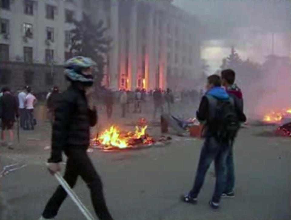 This image made from AP video shows a building on fire in Odessa, Ukraine, on Friday, May 2, 2014. Deadly clashes took place in the southern Ukraine port of Odessa on Friday, triggered by Ukraine's offensive to recapture the eastern city of Slovyansk from pro-Russia forces. (AP Photo via AP Video)