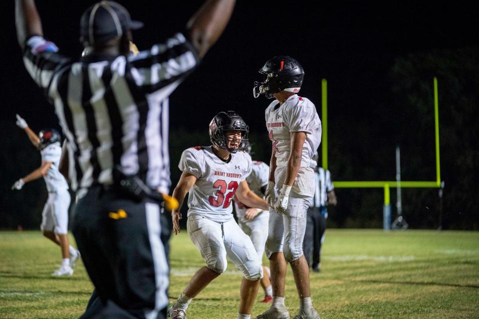 Saint Andrews John Boueri, center, celebrates with Dylan Faison in against West Boca Raton in West Boca Raton, Florida on September 8, 2023.