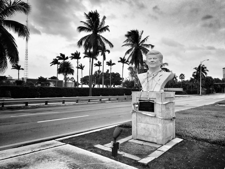 <p>A roadside bust of JFK is strapped down ahead of the arrival of Hurricane Irma Saturday in North Bay Village, Fla. (Photo: Holly Bailey/Yahoo News) </p>