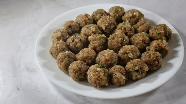 plate of raw meatballs