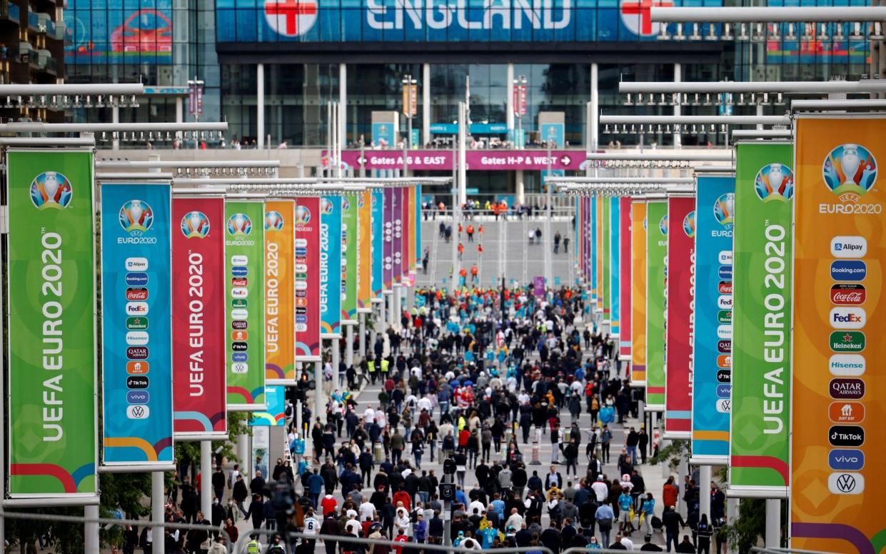  England supporters arrive at Wembley Stadium in west London on June 22, 2021, to watch the UEFA EURO 2020 football match between England and Czech Republic - AFP