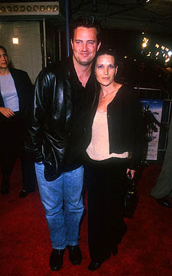 Matthew Perry with lady at the Mann Village Theater premiere of Warner Brothers' Three Kings