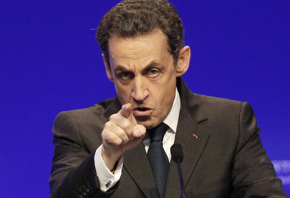 FILE - In this April 28, 2012 file photo, France's President and candidate for re-election in 2012, Nicolas Sarkozy, gestures as he delivers a speech during a campaign meeting in Cournon-d'Auvergne, central France. Former President Sarkozy is scheduled to go on trial Wednesday, March 17, on charges that his unsuccessful reelection bid in 2012 was illegally financed. (AP Photo/Michel Euler, File)