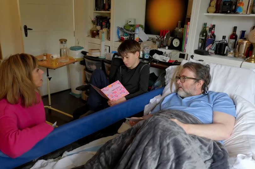 Derek in bed with son and kate by his side