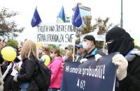 Bosnian demonstrators hold a banner which reads "We have woken up" during a protest against corruption and a delayed election in Sarajevo