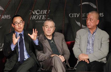 Lawrence Ho (L), Co-chairman and Chief Executive Officer (CEO) of Melco Crown Entertainment Limited, gestures next to actor Robert De Niro (C) and celebrity chef Nobuyuki "Nobu" Matsuhisa during a news conference in Manila January 27, 2014. REUTERS/Romeo Ranoco